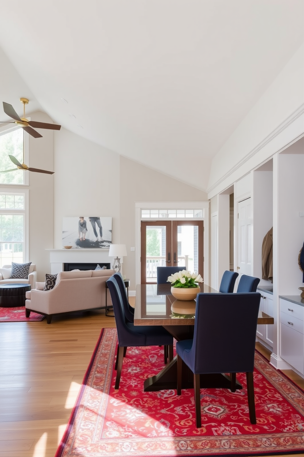 A spacious open layout seamlessly connects the living area to the dining room, featuring large windows that flood the space with natural light. The dining table is elegantly set with a modern centerpiece, surrounded by stylish chairs that complement the overall aesthetic. Adjacent to the dining room, the mudroom offers a functional yet chic design, with built-in storage solutions for shoes and coats. The mudroom is adorned with a vibrant area rug that adds warmth and character, creating a welcoming transition from the outdoors.