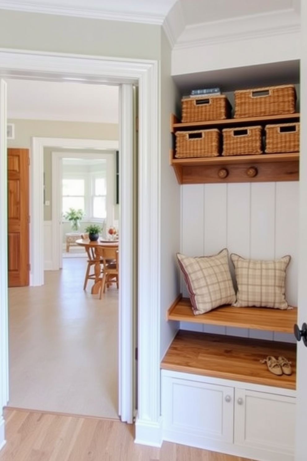 A mudroom designed for functionality and style. It features decorative baskets neatly arranged on a wooden shelf, providing clutter control while adding a touch of warmth. The space is painted in a soft neutral tone to complement the natural wood elements. A cozy bench is placed near the dining room, adorned with cushions for added comfort and inviting ambiance.