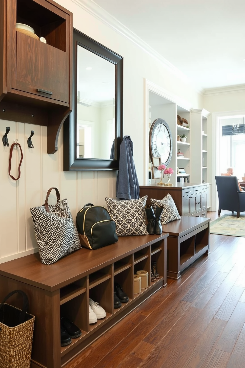 A functional drop zone for everyday items features a built-in bench with storage underneath, perfect for shoes and bags. The walls are adorned with hooks for coats and backpacks, while a large mirror above the bench enhances the space's utility. In the mudroom near the family room, a stylish yet practical design incorporates a combination of cabinetry and open shelving. The flooring is durable and easy to clean, providing a seamless transition between the mudroom and the family room.