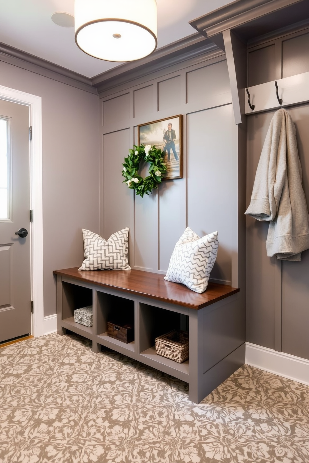 A cozy mudroom design featuring a bench with ample storage underneath. The walls are painted in soft gray, and the floor is covered with durable, patterned tiles for easy maintenance.