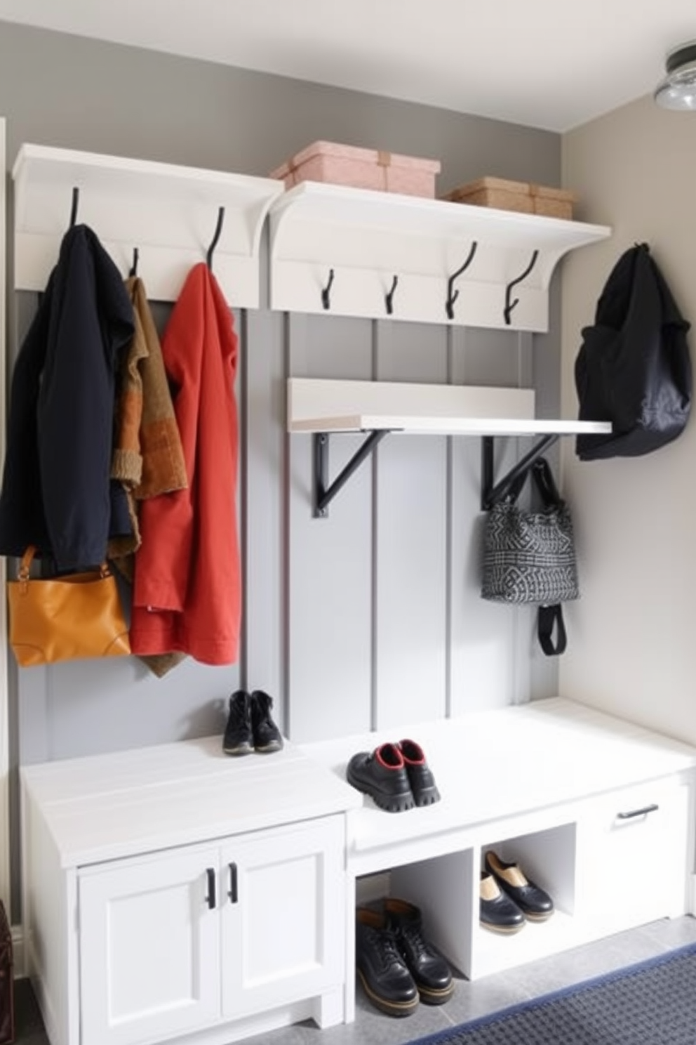 A functional mudroom near the garage features a wall-mounted folding table that can be easily tucked away when not in use. The space is designed with hooks for coats and bags, and a built-in bench with storage underneath for shoes and outdoor gear.