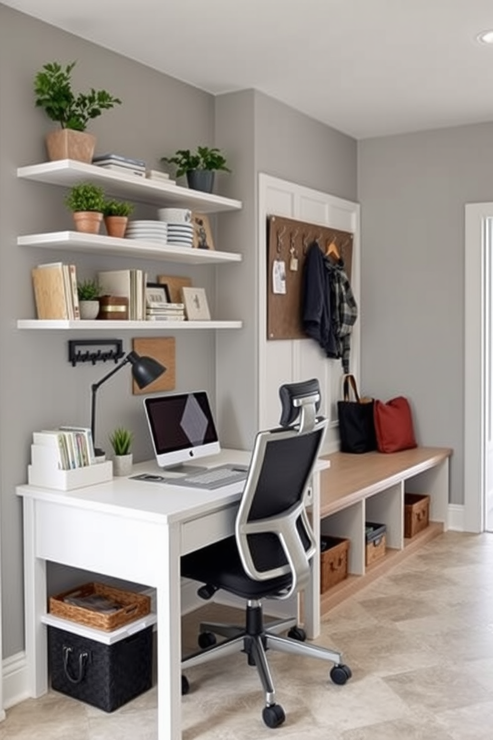 A small desk area for household management features a sleek white desk paired with a comfortable ergonomic chair. Above the desk, floating shelves display organized stationery and decorative plants, while a bulletin board keeps important notes and schedules visible. The mudroom near the garage is designed with practical storage solutions, including built-in benches and hooks for coats and bags. The walls are painted in a soft gray, and the floor is tiled with durable, easy-to-clean materials, ensuring a functional and welcoming entryway.