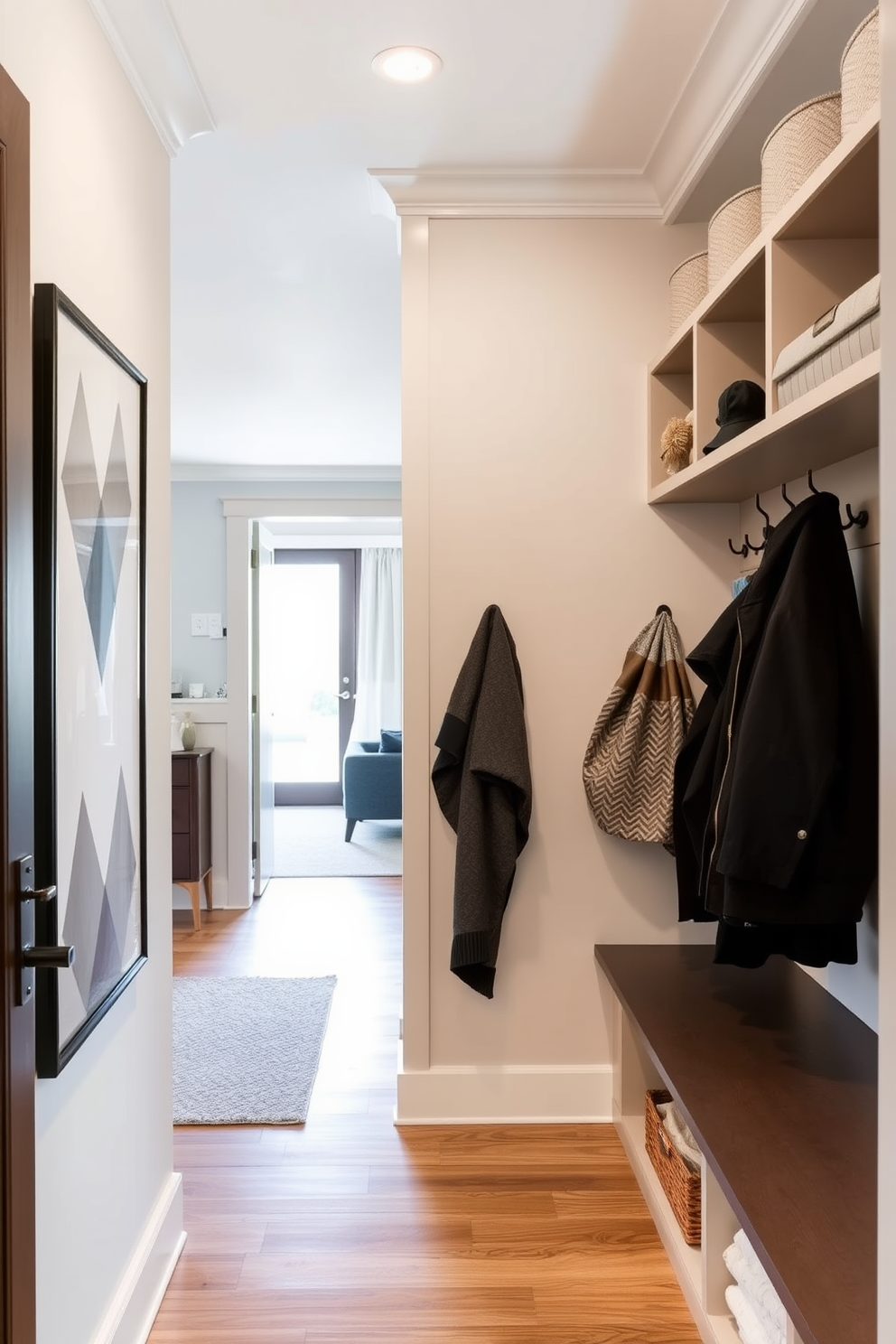 A stylish mudroom designed to maximize vertical storage in a small space. The walls are lined with built-in shelves and hooks for coats, while a sleek bench provides seating and additional storage underneath. Adjacent to the living room, the mudroom features a cohesive color palette that complements the main living area. Natural light floods the space through a nearby window, enhancing the inviting atmosphere.