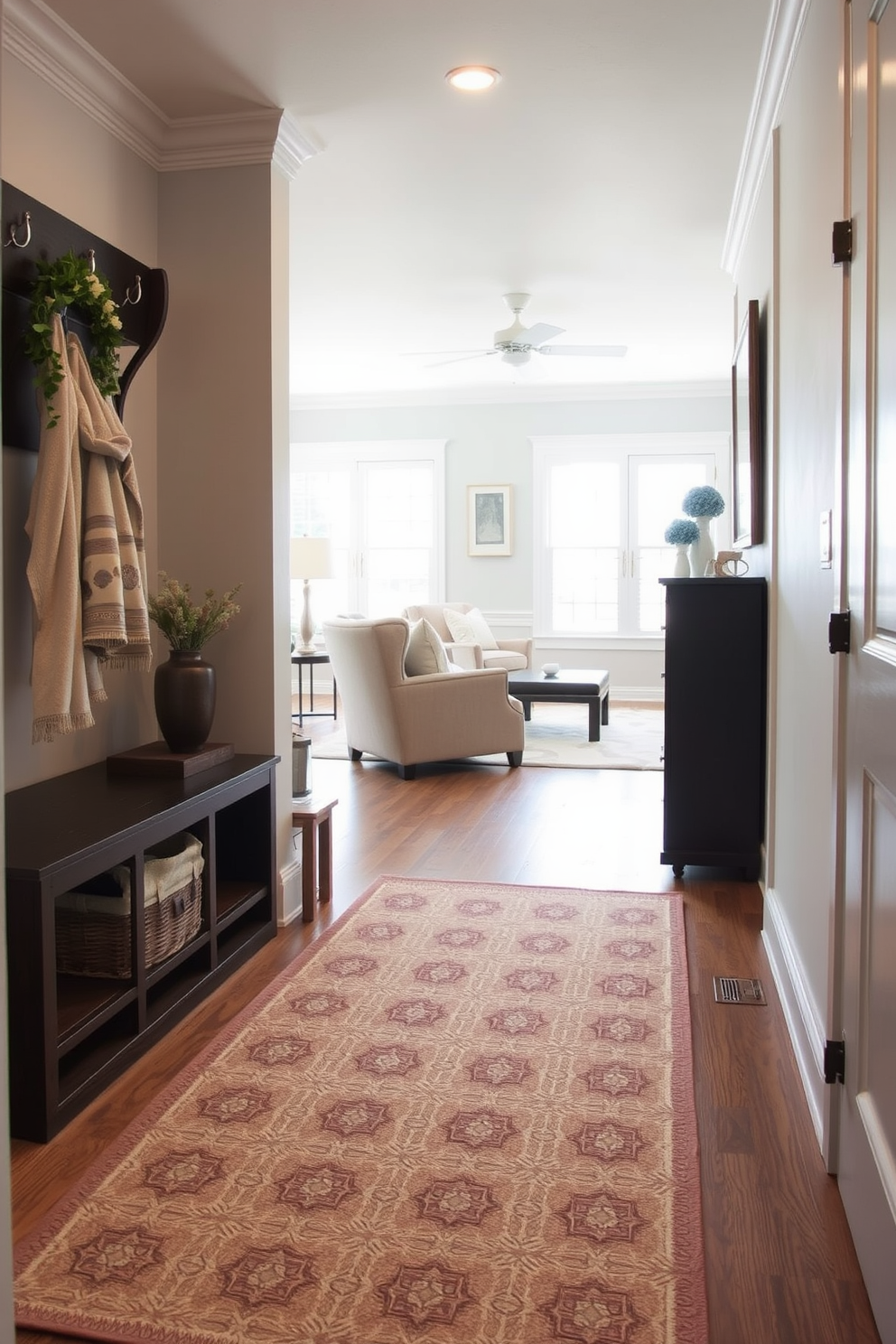 A stylish area rug adds both comfort and elegance to the mudroom near the living room. The rug features a geometric pattern in soft earth tones that complements the surrounding decor and creates a welcoming atmosphere.