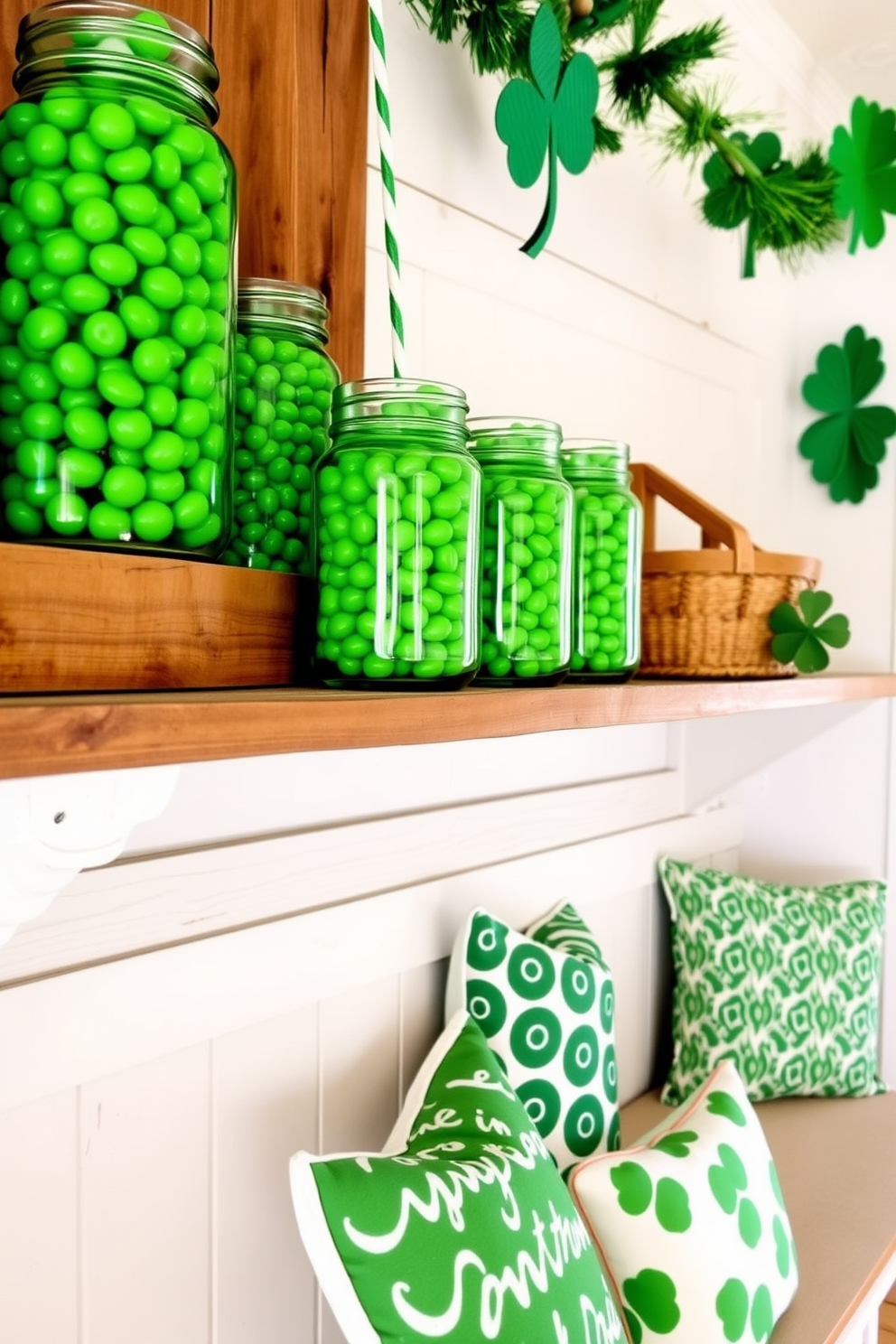 Mason jars filled with green candies are arranged on a rustic wooden shelf. The vibrant candies create a playful and festive atmosphere, perfect for St. Patrick's Day celebrations. In the mudroom, a cozy bench is adorned with green and white patterned cushions. Decorative shamrocks and garlands hang on the walls, enhancing the cheerful holiday spirit.