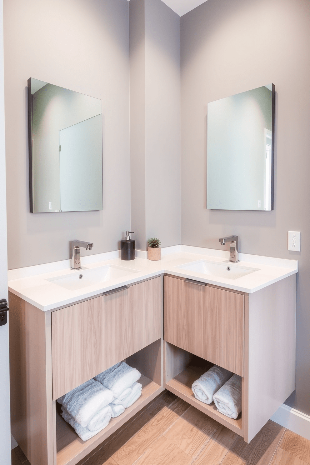 A narrow bathroom featuring a long double vanity with a sleek white countertop and modern faucets. Above the vanity, two frameless mirrors are mounted on the wall, creating a sense of openness. The walls are painted in a soft gray tone, enhancing the feeling of space. The floor is adorned with light-colored wood tiles, adding warmth to the design. On the vanity, decorative items include a stylish soap dispenser and a small potted plant for a touch of greenery. Fluffy white towels are neatly rolled and displayed on an open shelf beneath the vanity.