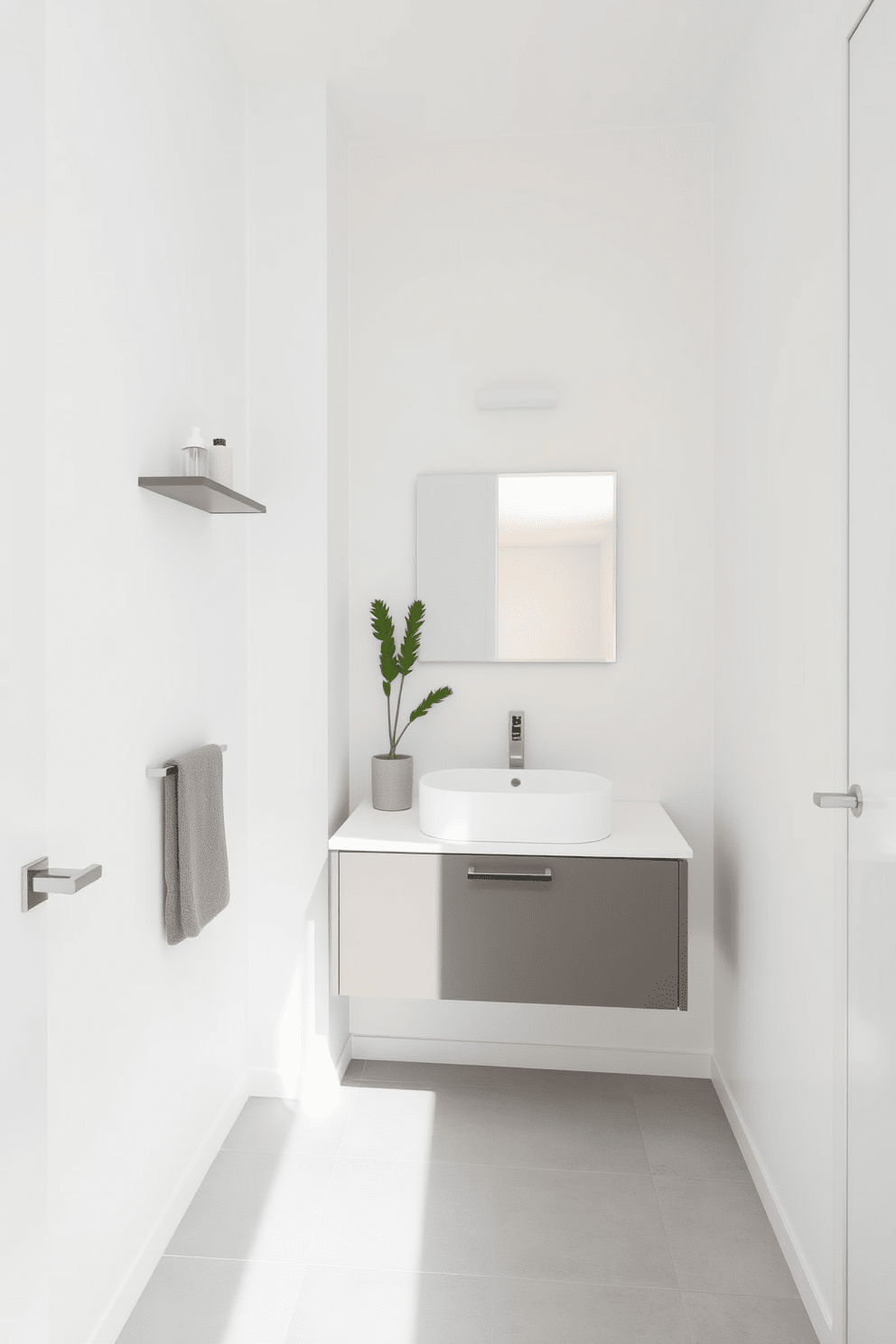 A narrow bathroom featuring minimalist decor with a focus on clean lines and functionality. The walls are painted in a soft white hue, complemented by a sleek floating vanity with a single basin and a large frameless mirror above. The floor is adorned with light gray tiles that enhance the sense of space. Simple wall-mounted shelves hold a few curated decor items, while a single potted plant adds a touch of greenery without overwhelming the design.