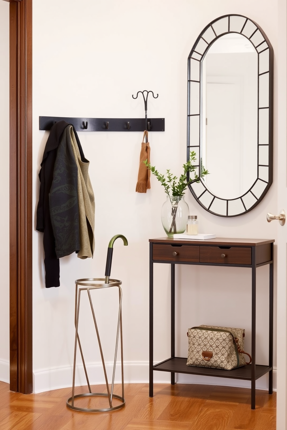 A stylish umbrella stand made of sleek metal with a minimalist design sits in the corner of a narrow entryway. The stand features a contemporary shape and is complemented by a small potted plant nearby, adding a touch of greenery to the space. Narrow entryway design ideas include a wall-mounted coat rack with hooks for storing jackets and bags. A slim console table with a decorative mirror above it creates a welcoming atmosphere while maximizing the limited space.