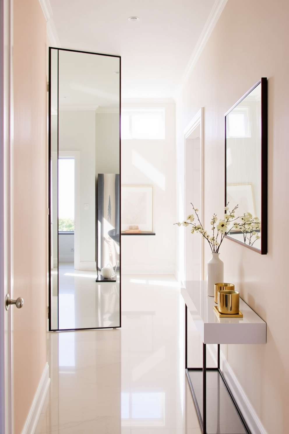 A narrow foyer featuring a large mirror that reflects natural light, creating an illusion of spaciousness. The walls are adorned with soft pastel colors, and a sleek console table sits against one side, topped with decorative accessories.