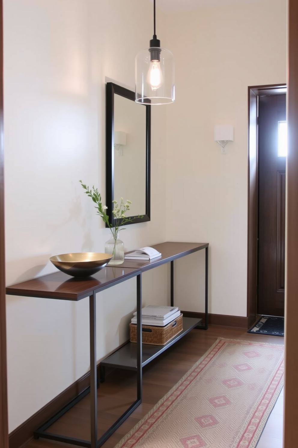 A narrow foyer features a sleek console table against one wall, perfect for organizing keys and mail. The table is complemented by a stylish decorative bowl for small items and a framed mirror above it to enhance the space. Soft lighting from a pendant fixture illuminates the area, creating a warm and inviting atmosphere. The walls are painted in a light neutral tone, while a small rug adds texture and warmth underfoot.