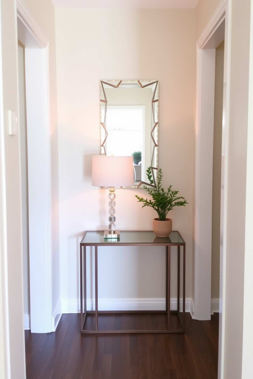 A narrow foyer featuring a slim console table against the wall. The console table is adorned with a decorative lamp and a small potted plant, creating an inviting entryway. The walls are painted in a soft neutral tone, enhancing the sense of space. A stylish mirror hangs above the console, reflecting light and adding depth to the area.