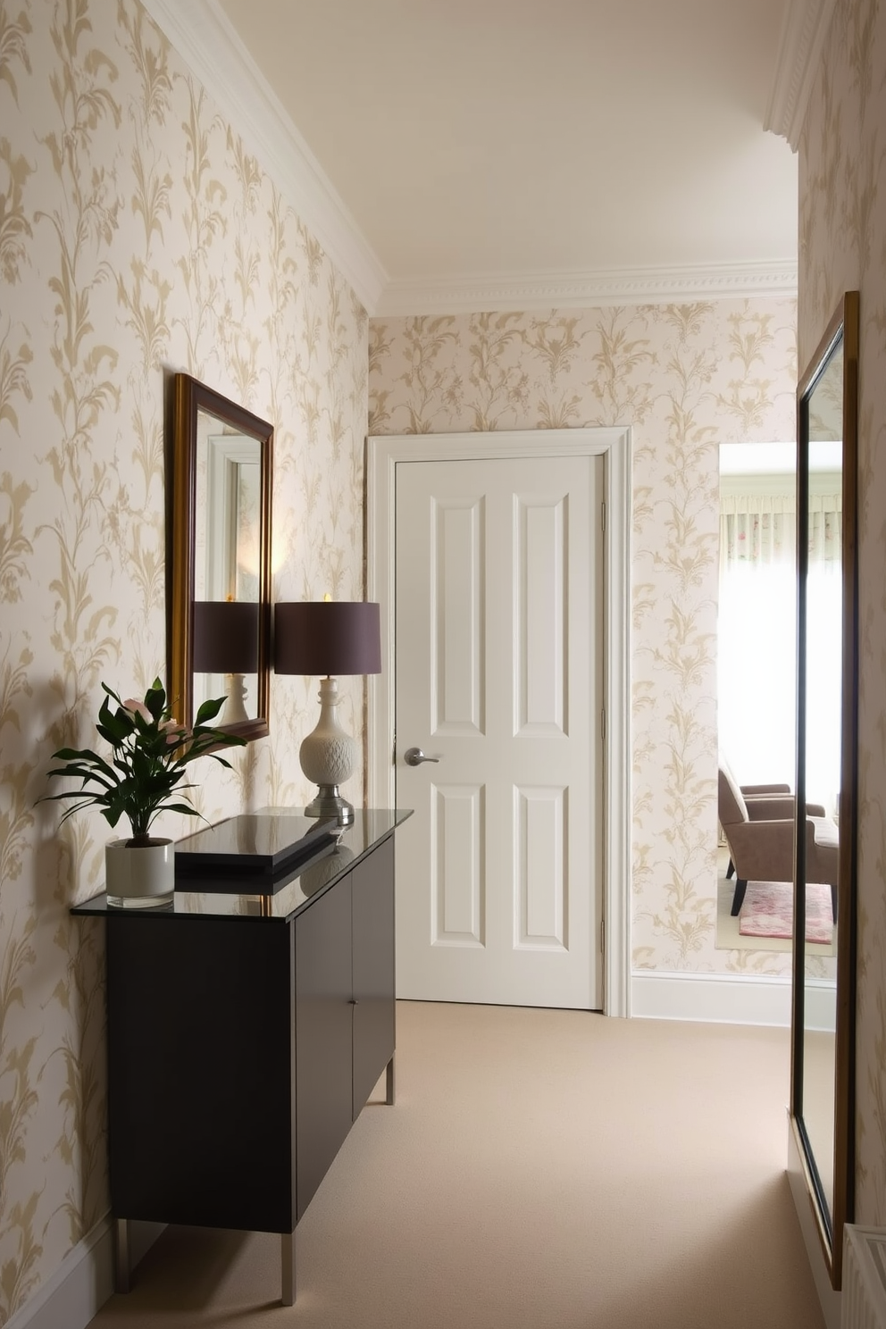 A narrow foyer featuring elegant wallpaper as a stylish backdrop. The walls are adorned with a delicate floral pattern, creating a warm and inviting atmosphere. A sleek console table is positioned against one wall, topped with a decorative lamp and a small potted plant. To the side, a full-length mirror reflects the light, enhancing the sense of space in the foyer.