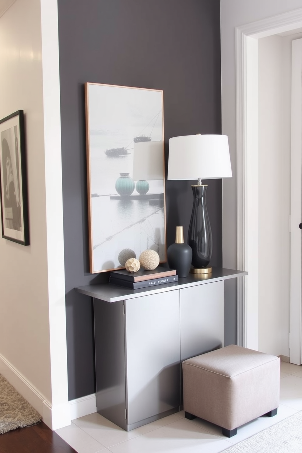 A narrow foyer featuring a sleek console table against one wall, adorned with a stylish lamp and decorative objects. To the side, a small ottoman provides flexibility for seating or storage, enhancing the functionality of the space.