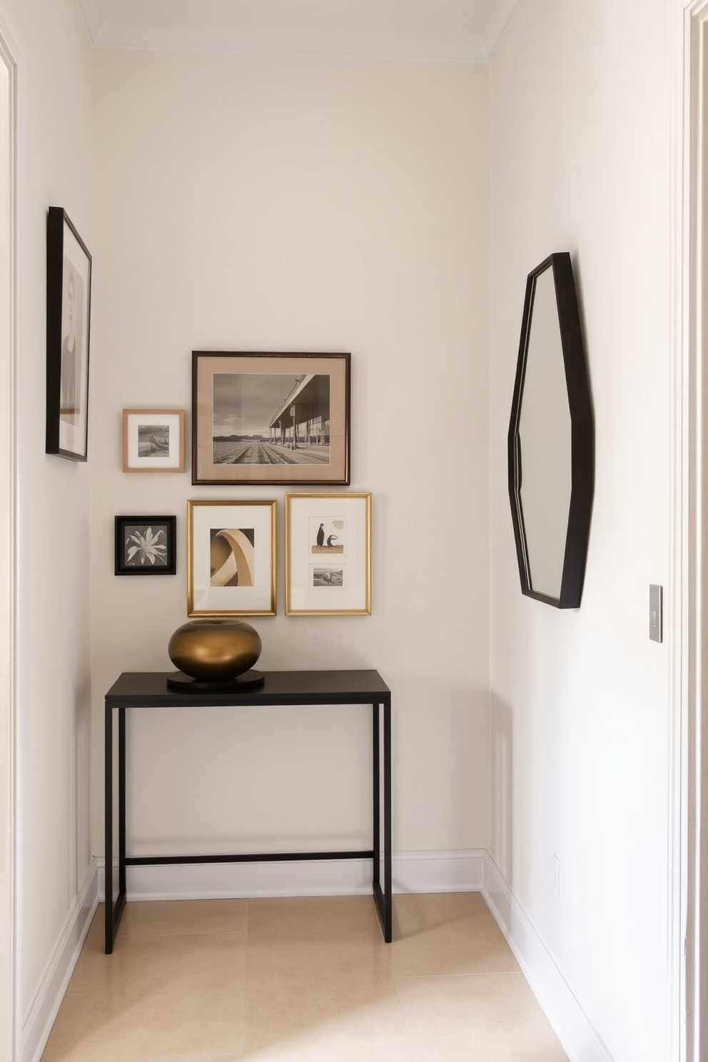 A narrow foyer with a sleek console table against one wall. Above the table, a collection of framed artwork in varying sizes adds visual interest and depth to the space. The walls are painted in a soft, neutral tone to enhance the feeling of openness. A stylish mirror opposite the console reflects light and makes the foyer feel more expansive.