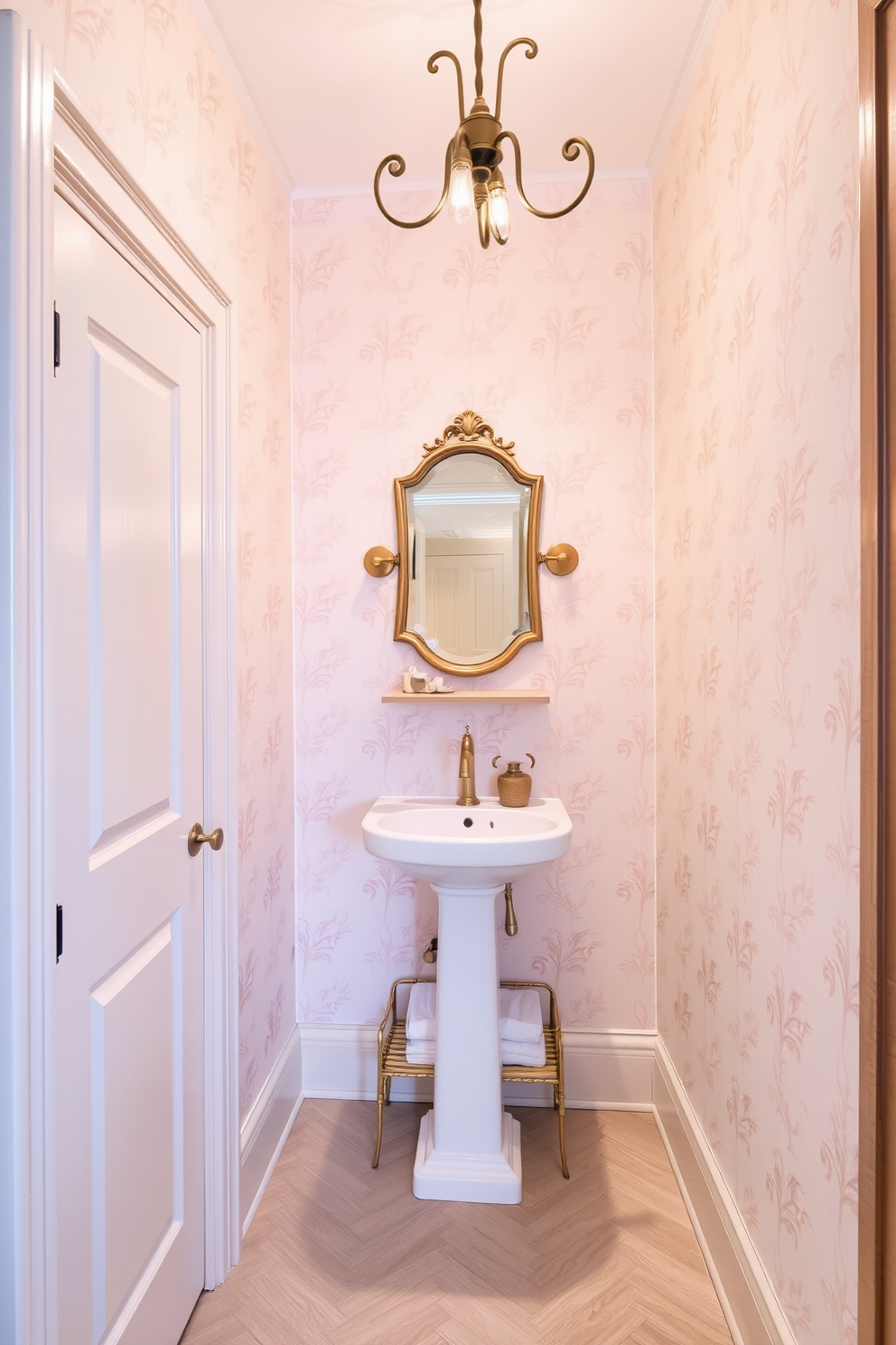 A narrow powder room with a pocket door for seamless access. The walls are adorned with soft pastel wallpaper, creating a light and airy feel. A sleek pedestal sink is positioned against one wall, complemented by a stylish wall-mounted faucet. Above the sink, a vintage-style mirror adds character, while a small shelf below holds decorative items and fresh hand towels. The flooring features elegant herringbone tiles in a neutral tone, enhancing the room's spaciousness. A whimsical light fixture hangs from the ceiling, providing warm illumination and a touch of charm.