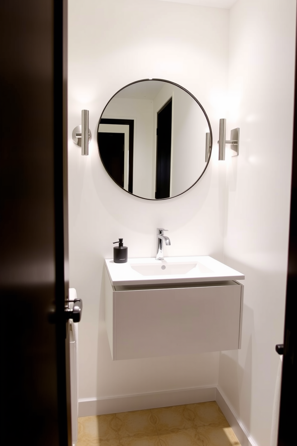 A sleek floating vanity is mounted on the wall, creating an illusion of more space in the narrow powder room. The vanity features a minimalist design with a white countertop and integrated sink, complemented by elegant wall sconces on either side. The walls are painted in a light, airy color to enhance the feeling of openness. A large round mirror hangs above the vanity, reflecting natural light and adding depth to the compact area.