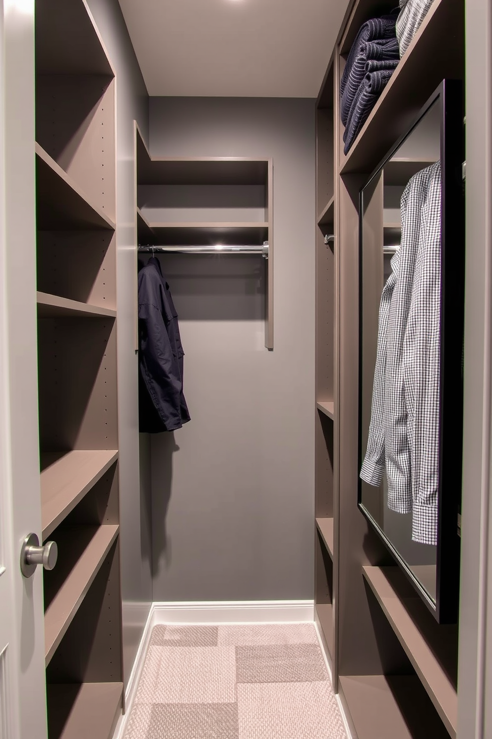 A narrow walk-in closet features sleek built-in shelving and hanging space for clothing. The walls are painted in a soft gray, creating a calm atmosphere, while a full-length mirror is mounted on the door for convenience.