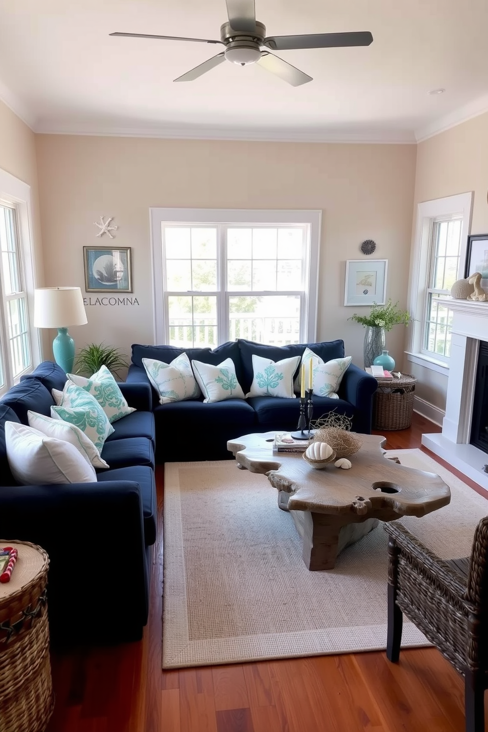 A cozy living room featuring a navy blue couch with coastal-themed accents. The couch is adorned with white and turquoise throw pillows, and a light-colored area rug anchors the space. Natural light floods in through large windows, highlighting the soft beige walls and driftwood-inspired coffee table. A collection of seashells and coastal artwork decorates the walls, enhancing the beachy atmosphere.