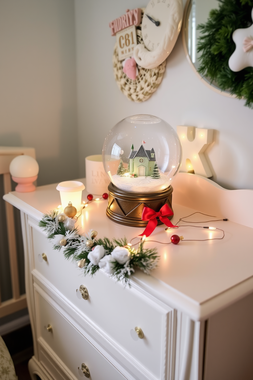 A charming nursery decorated for Christmas features a beautifully crafted dresser adorned with a decorative snow globe. The snow globe showcases a whimsical winter scene, surrounded by festive accents like small ornaments and twinkling lights.