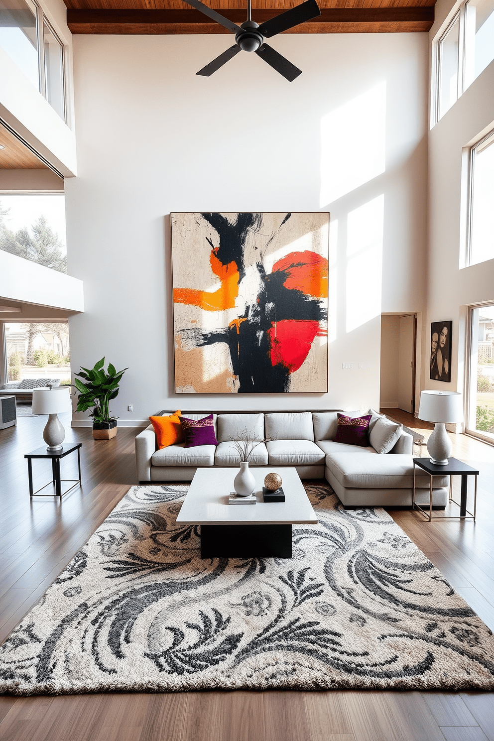 A spacious living room featuring an open floor plan with high ceilings and large windows allowing natural light to flood the space. The focal point is a statement piece of large-scale artwork displayed prominently on the main wall, creating a dramatic effect that enhances the overall aesthetic. The living area is furnished with a plush sectional sofa in a neutral tone, complemented by vibrant accent pillows. A sleek coffee table sits at the center, surrounded by stylish side tables and a cozy area rug that ties the design together.