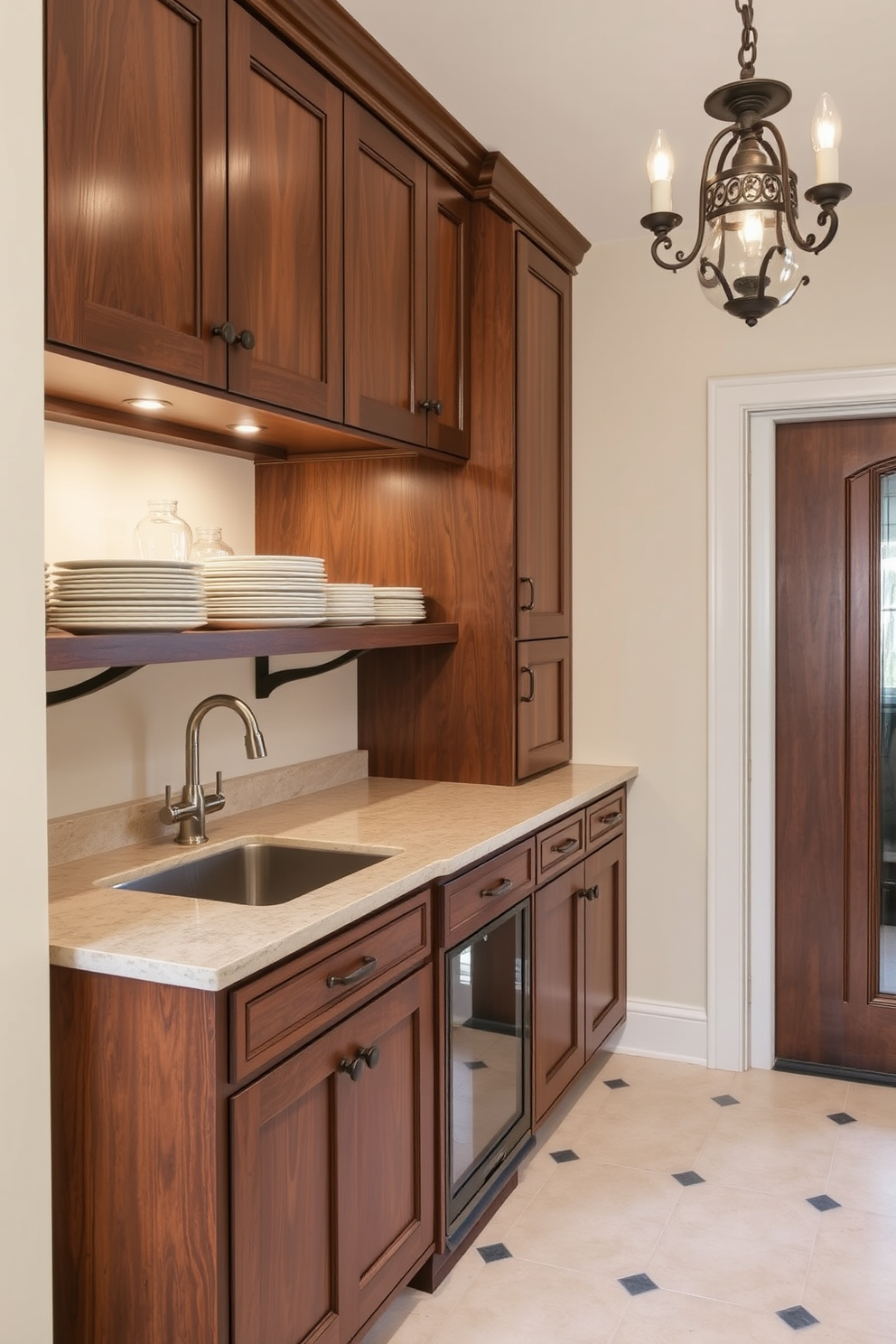 A stylish butler pantry designed for additional prep space. It features custom cabinetry with a rich wood finish, a spacious countertop for food preparation, and elegant shelving for displaying dishware. The walls are painted in a soft cream color, enhancing the warm ambiance. A vintage-inspired light fixture hangs above, providing a cozy glow to the space.