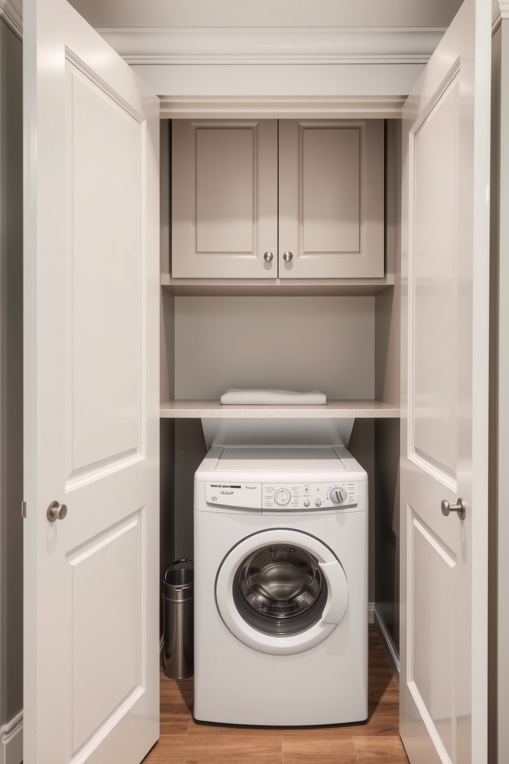 A hidden laundry area seamlessly integrated behind elegant doors. The space features a stackable washer and dryer with a countertop above for folding clothes, surrounded by cabinetry for storage.