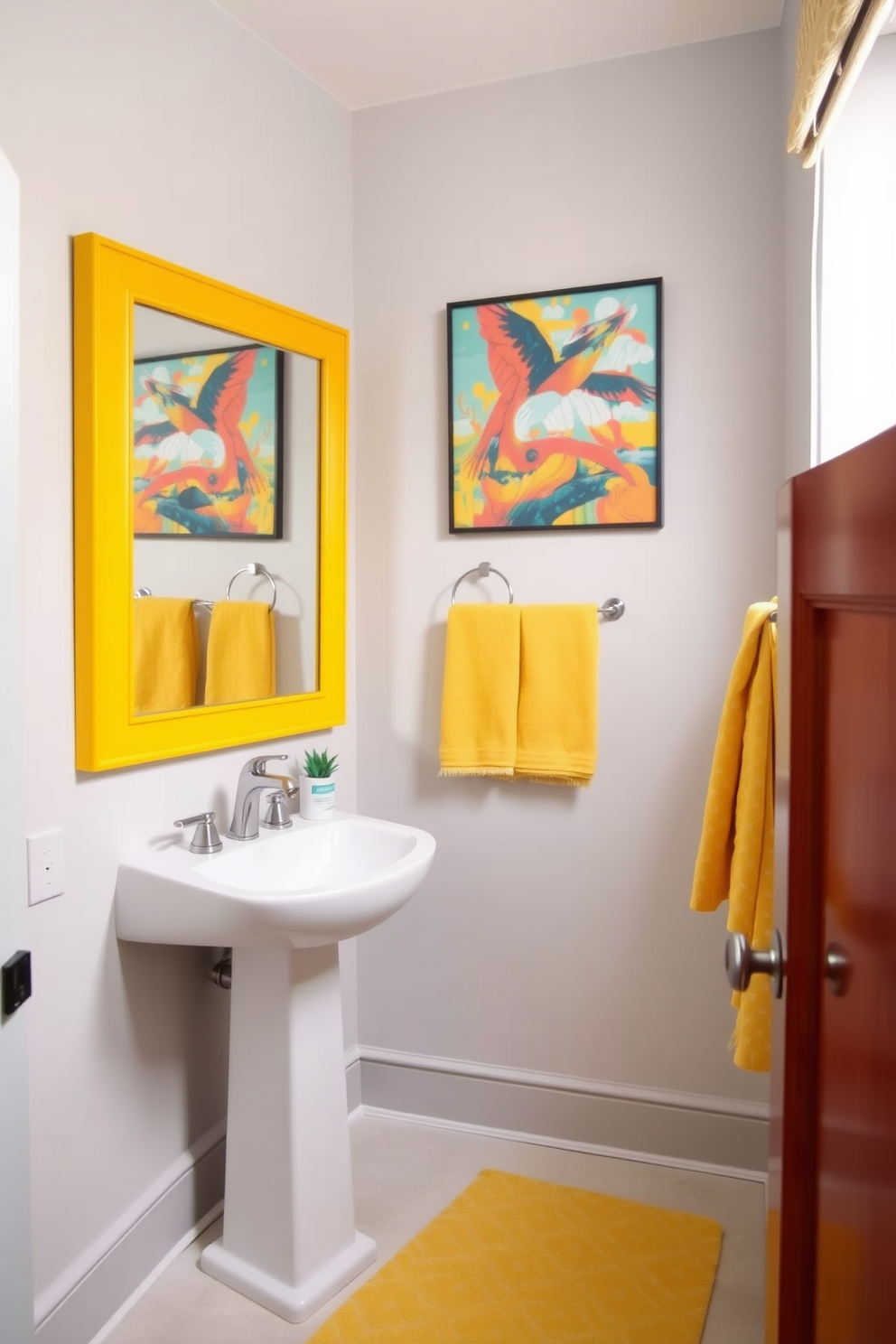 A bright powder room features vibrant yellow accents against a soft gray backdrop. The walls are painted in a light gray tone, creating a serene atmosphere while colorful artwork adds a playful touch. A sleek white pedestal sink is complemented by a bold yellow mirror that stands out as a focal point. Brightly patterned towels and a cheerful rug enhance the lively feel of the space, inviting guests to enjoy this stylish retreat.