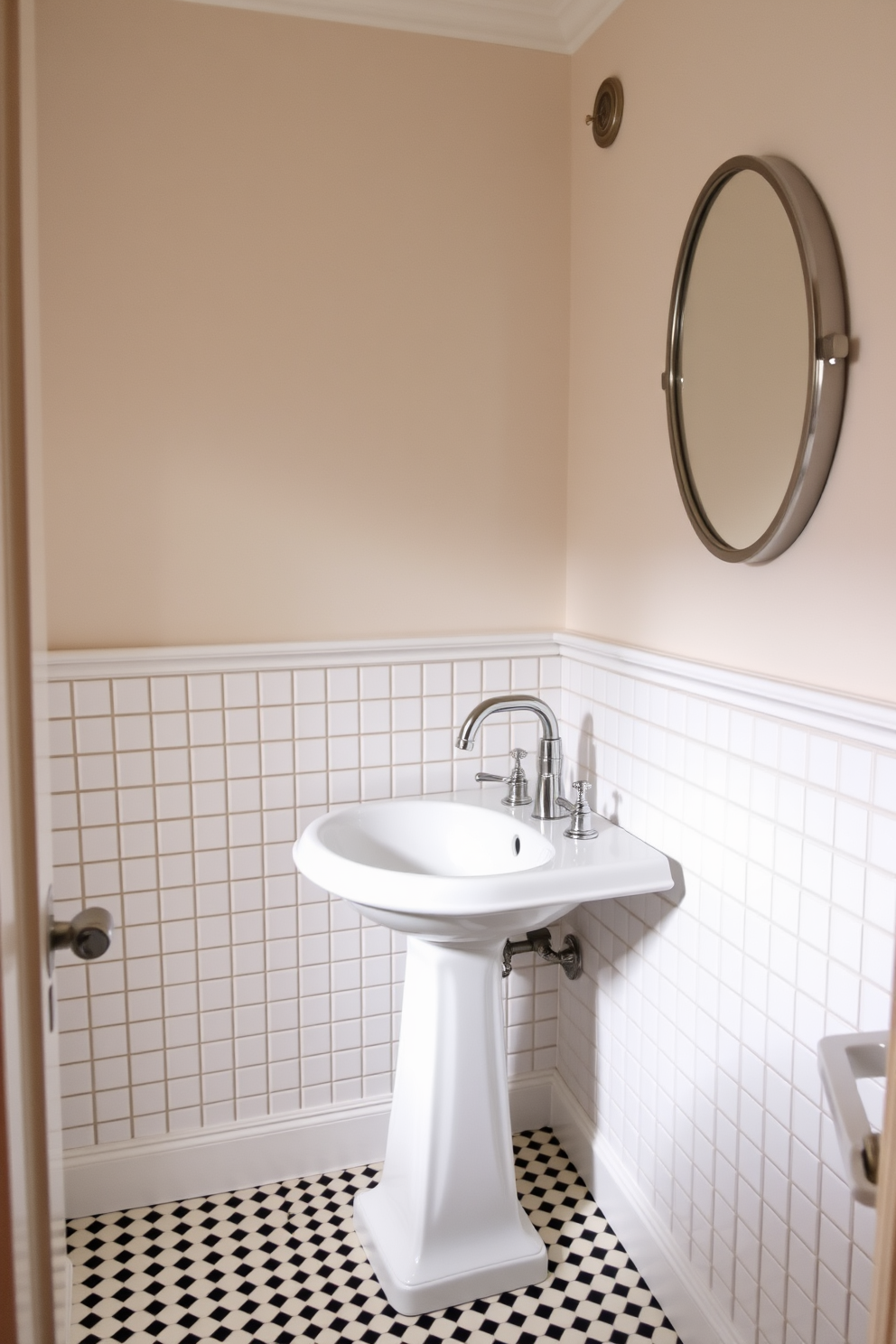 A charming powder room features small square tiles in a classic white and black checkerboard pattern. The tiles create a timeless elegance that complements the vintage-inspired fixtures and soft lighting. The walls are adorned with wainscoting painted in a soft pastel hue, enhancing the room's inviting atmosphere. A sleek pedestal sink sits against the wall, topped with a polished chrome faucet that adds a touch of modern sophistication.