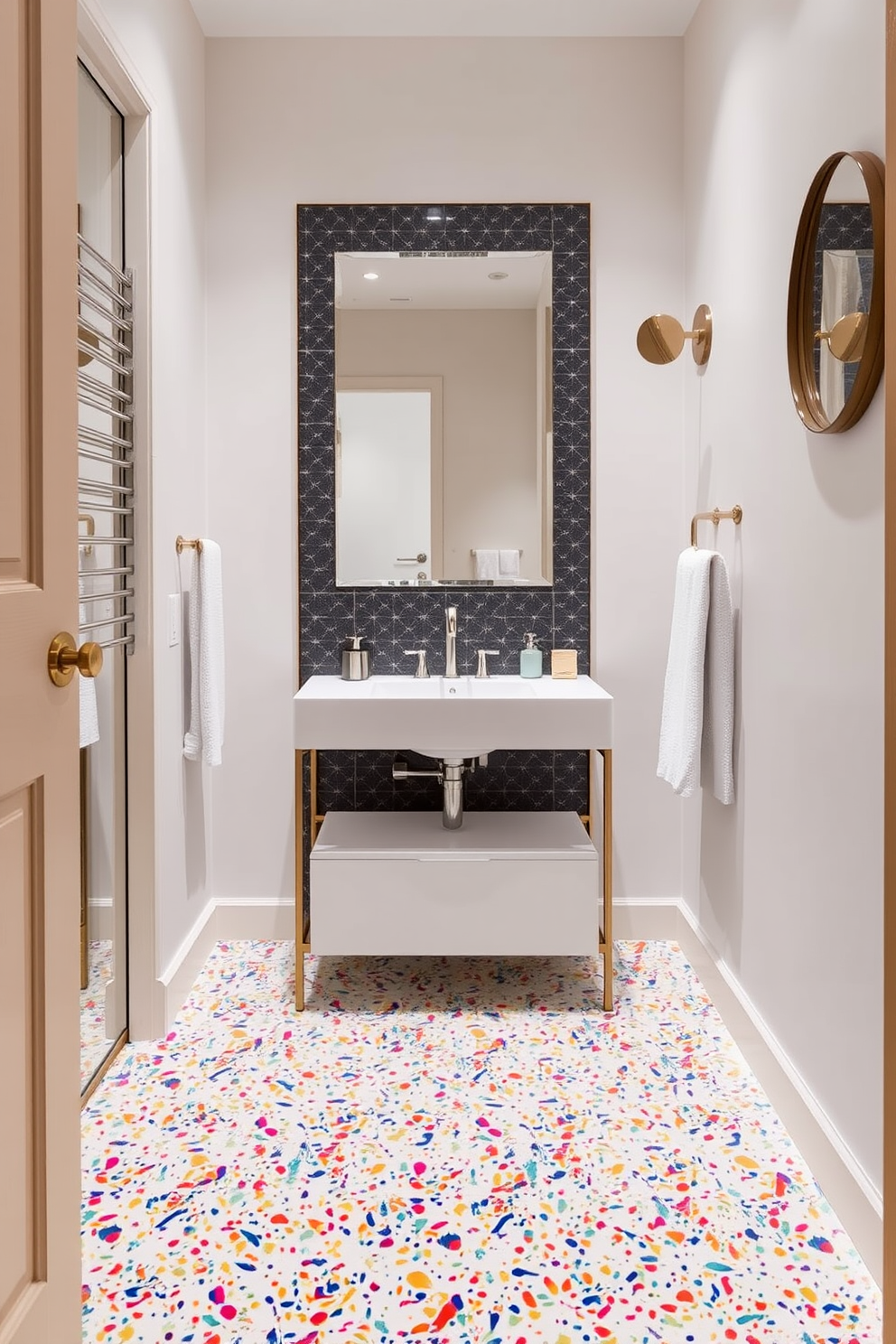 A stylish powder room features vibrant terrazzo tiles that create a trendy and eye-catching floor. The colorful speckles in the tiles add a playful touch, complementing the modern fixtures and sleek design elements throughout the space. The walls are adorned with a soft neutral paint, allowing the terrazzo floor to be the focal point of the room. A minimalist vanity with a chic sink sits atop the floor, providing a perfect contrast to the lively tiles below.