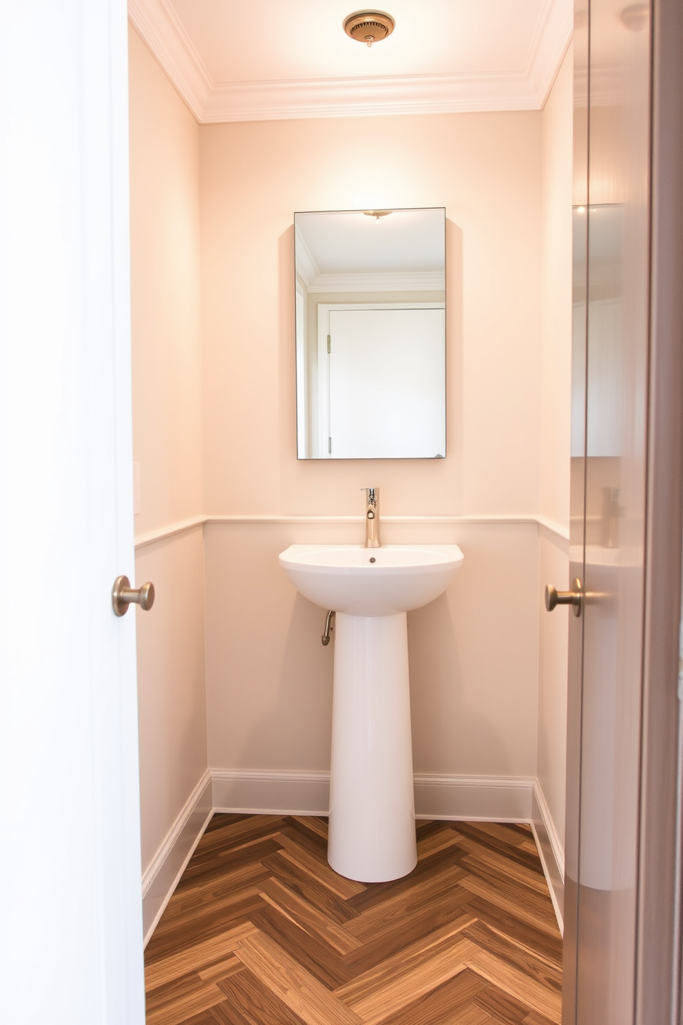 A stylish powder room featuring wood-look tiles that exude warmth and elegance. The walls are adorned with soft, neutral colors, creating a serene atmosphere complemented by a sleek pedestal sink. The floor showcases a stunning pattern of wood-look tiles that seamlessly blend with the overall decor. A minimalist mirror above the sink reflects the tasteful lighting, enhancing the inviting ambiance of the space.