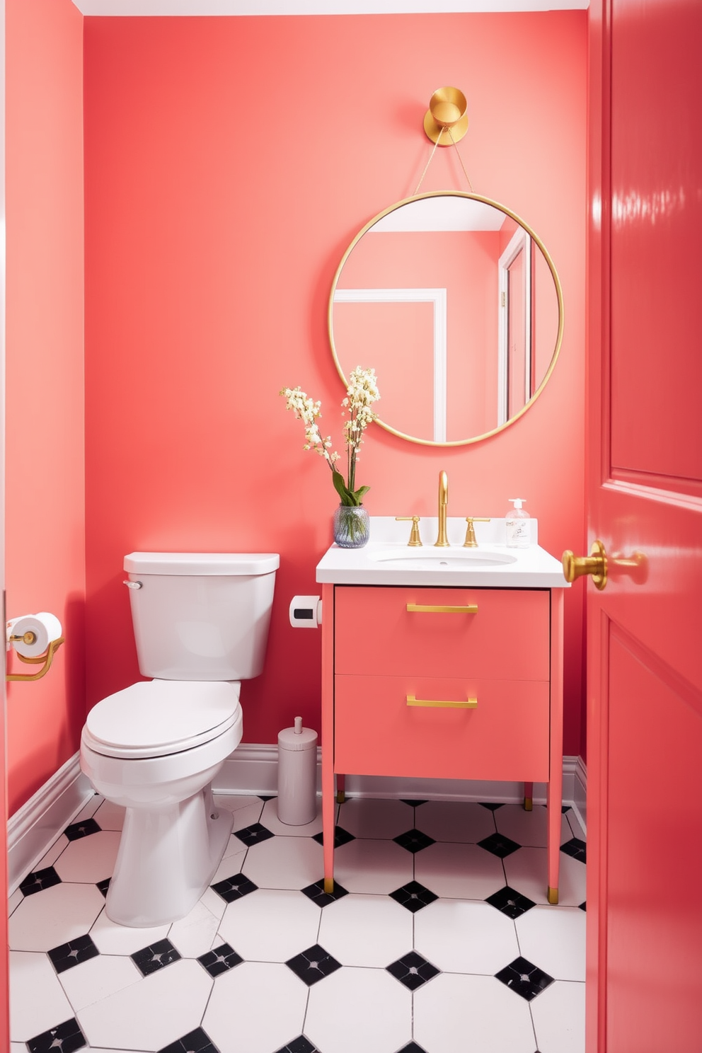 A bright coral powder room features vibrant walls that instantly uplift the space. The playful color is complemented by white fixtures and a sleek, modern vanity with gold accents. The floor is adorned with classic black and white tiles that add a touch of elegance. A round mirror with a thin gold frame hangs above the vanity, enhancing the room's cheerful atmosphere.