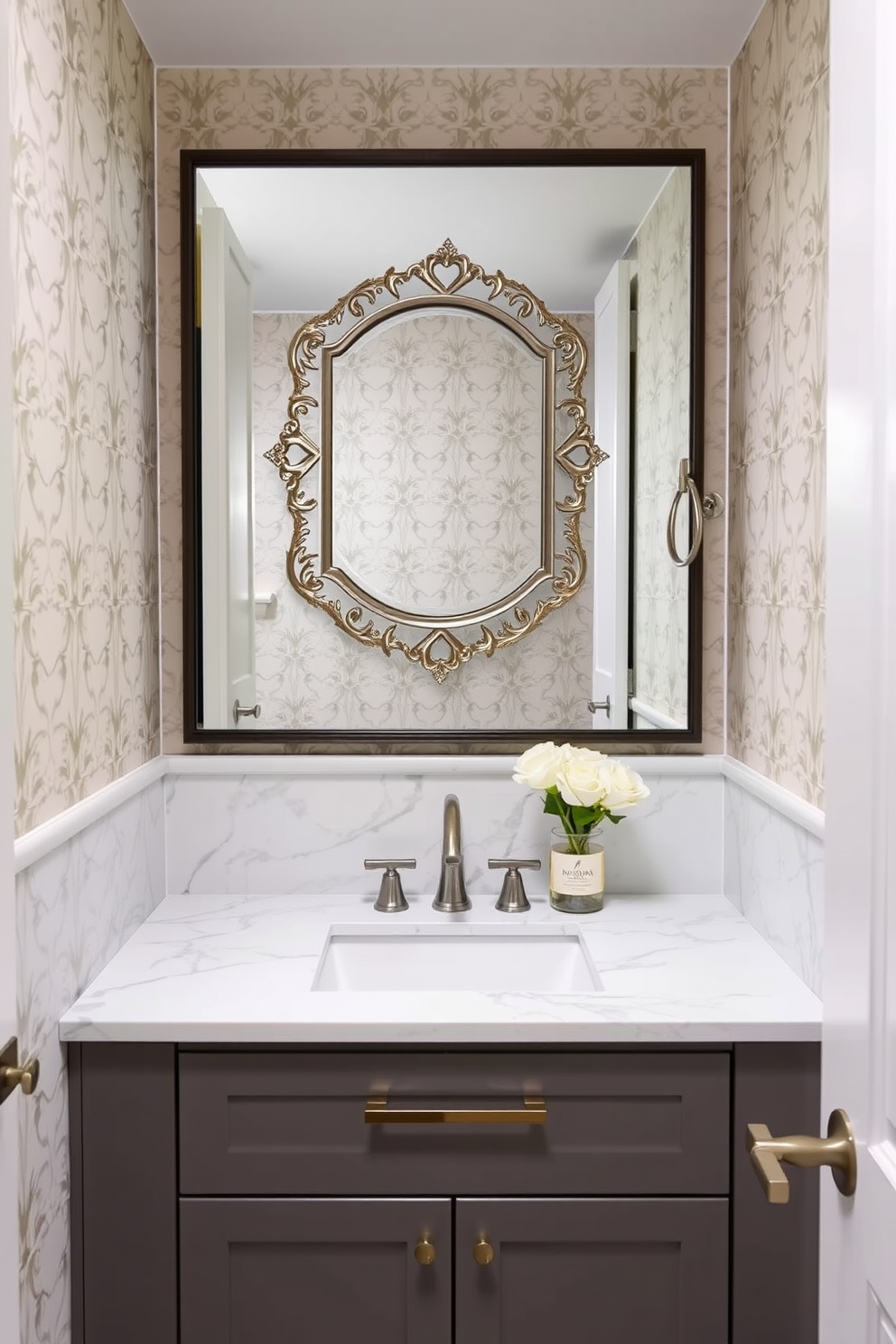 A stylish powder room featuring a sleek marble countertop with an undermount sink. The walls are adorned with elegant wallpaper in soft tones, and a chic mirror with a decorative frame enhances the space.