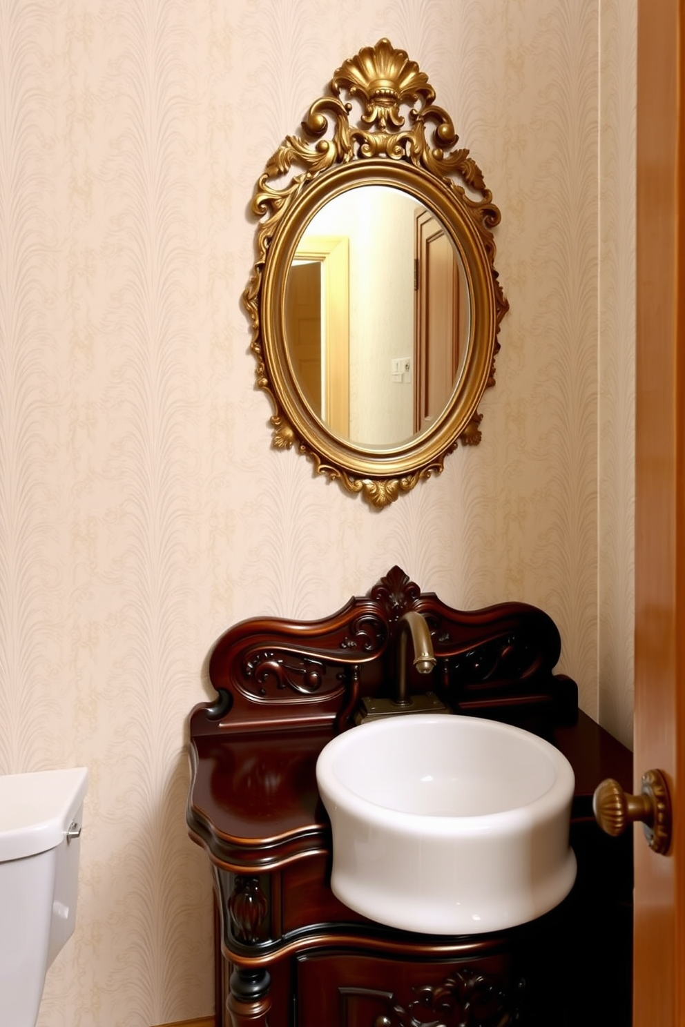 A charming powder room featuring an antique washstand with an integrated sink. The washstand is crafted from dark wood with intricate carvings and a polished white porcelain sink seamlessly integrated into the top. The walls are adorned with soft pastel wallpaper that complements the vintage aesthetic. A small round mirror with an ornate gold frame hangs above the washstand, reflecting the elegant design of the space.