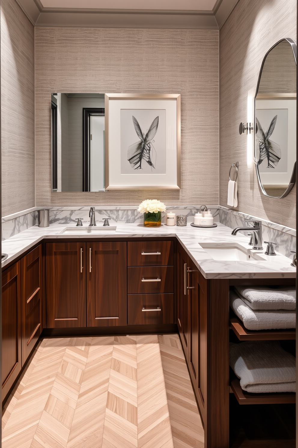 A luxurious double sink powder room features an elegant marble countertop with two stylish undermount sinks. The cabinetry is a rich walnut finish, complemented by polished chrome fixtures and ambient lighting that enhances the sophisticated atmosphere. The walls are adorned with a soft gray wallpaper, while the floor showcases a herringbone pattern in light oak. Decorative elements include a chic framed artwork above the sinks and plush towels neatly arranged on a nearby shelf.