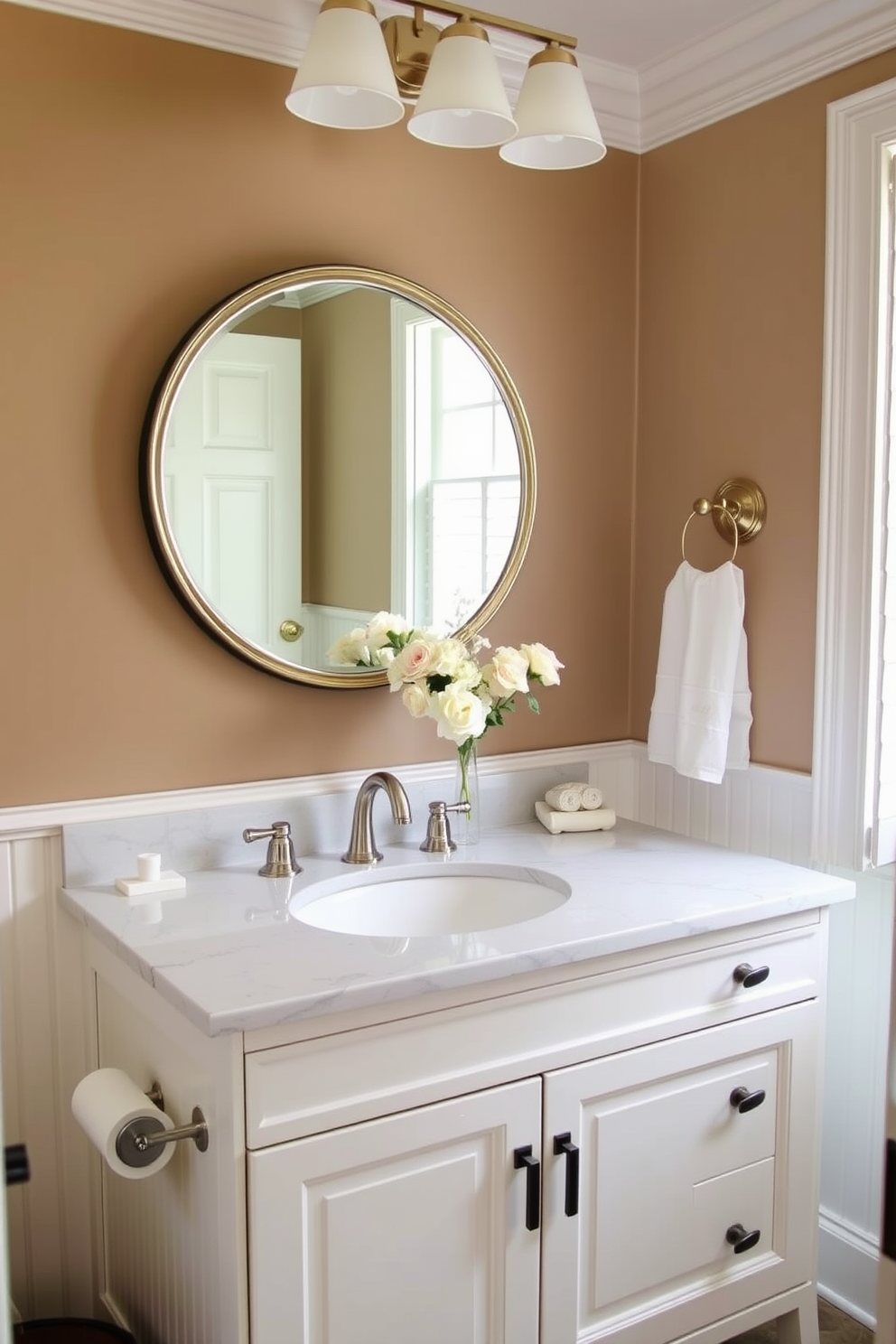 A classic white vanity with beadboard paneling serves as the centerpiece of the powder room. The vanity features a polished marble countertop with elegant fixtures and a stylish round mirror above it. Soft lighting illuminates the space, enhancing the warm tones of the decor. A delicate floral arrangement sits on the countertop, adding a touch of freshness to the inviting atmosphere.