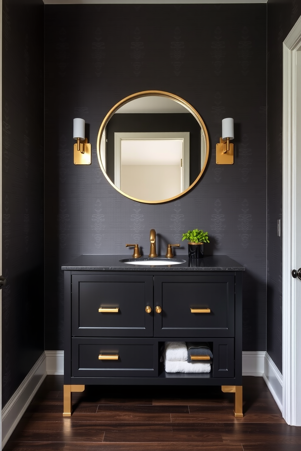 A stylish black vanity with brass hardware serves as the centerpiece of the powder room. The walls are adorned with elegant wallpaper featuring a subtle geometric pattern, complementing the sophisticated design. Above the vanity, a large round mirror with a brass frame reflects the ambient lighting from a chic sconce on either side. The floor is finished with dark wood planks, adding warmth to the modern aesthetic while a small potted plant sits on the vanity for a touch of greenery.