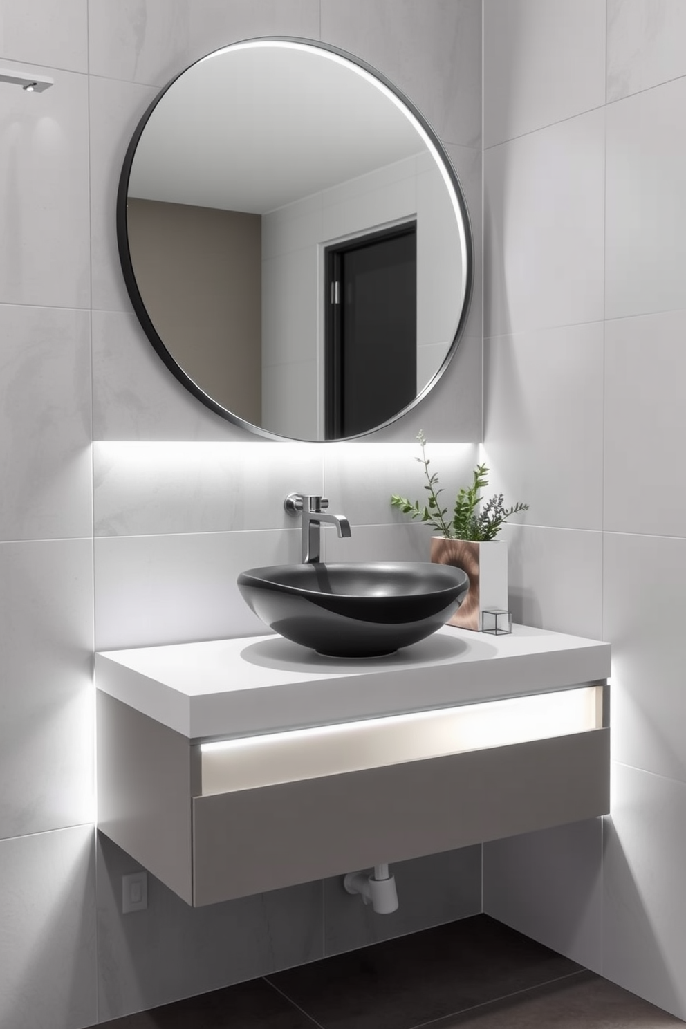 A sleek floating vanity is designed with integrated LED lighting that highlights its modern lines. The vanity features a smooth white countertop and a stylish vessel sink, creating a clean and contemporary look. The walls are adorned with soft gray tiles that complement the vanity's design. A large round mirror above the vanity enhances the space, while decorative accents like a small potted plant add a touch of warmth.