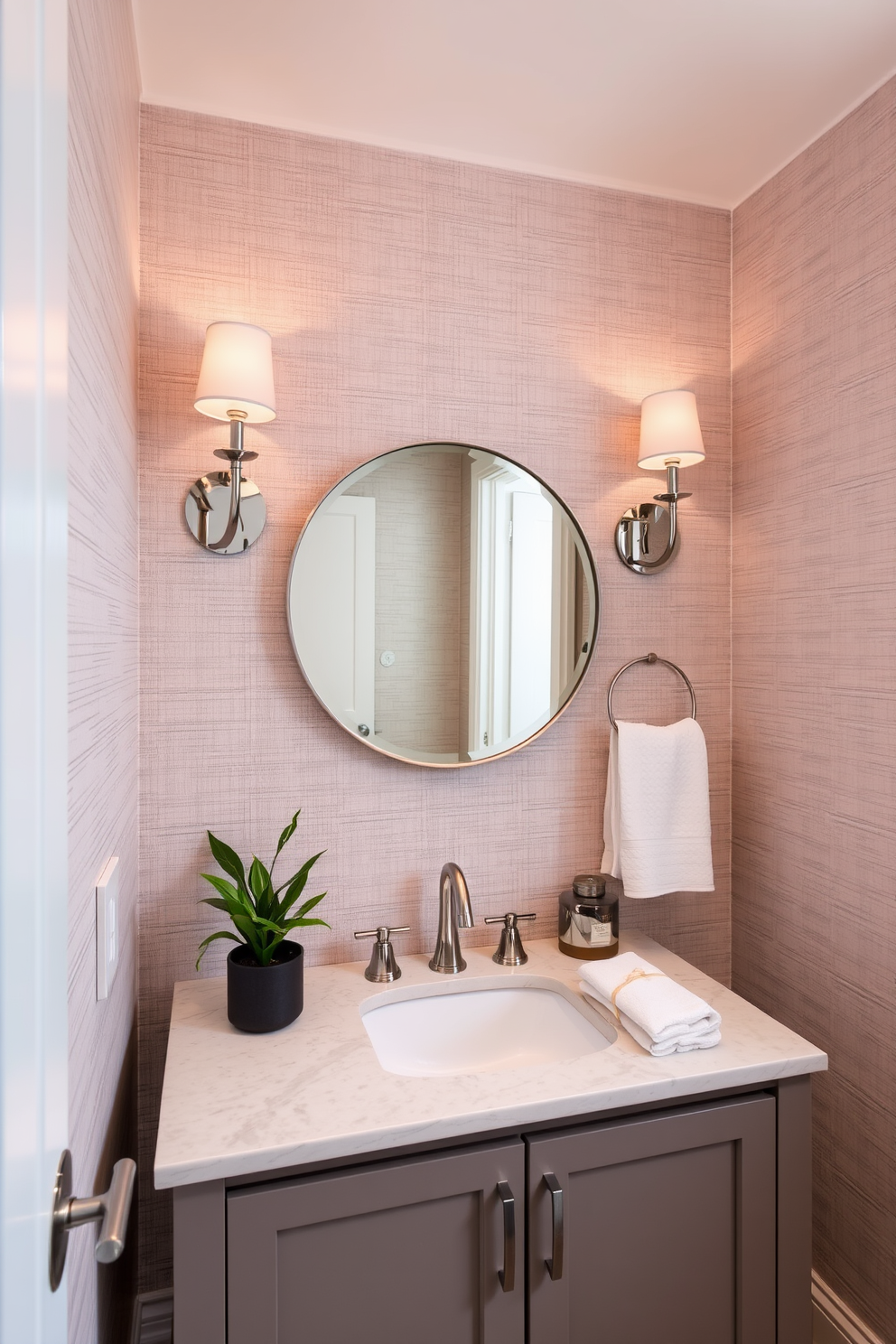 A stylish powder room featuring textured wall coverings that add depth and character to the space. The walls are adorned with a subtle fabric wallpaper in a soft hue, complemented by elegant sconces that cast a warm glow. The vanity is a sleek design with a polished stone countertop and a round mirror above it. Decorative accents like a small potted plant and luxurious hand towels enhance the overall aesthetic of the room.