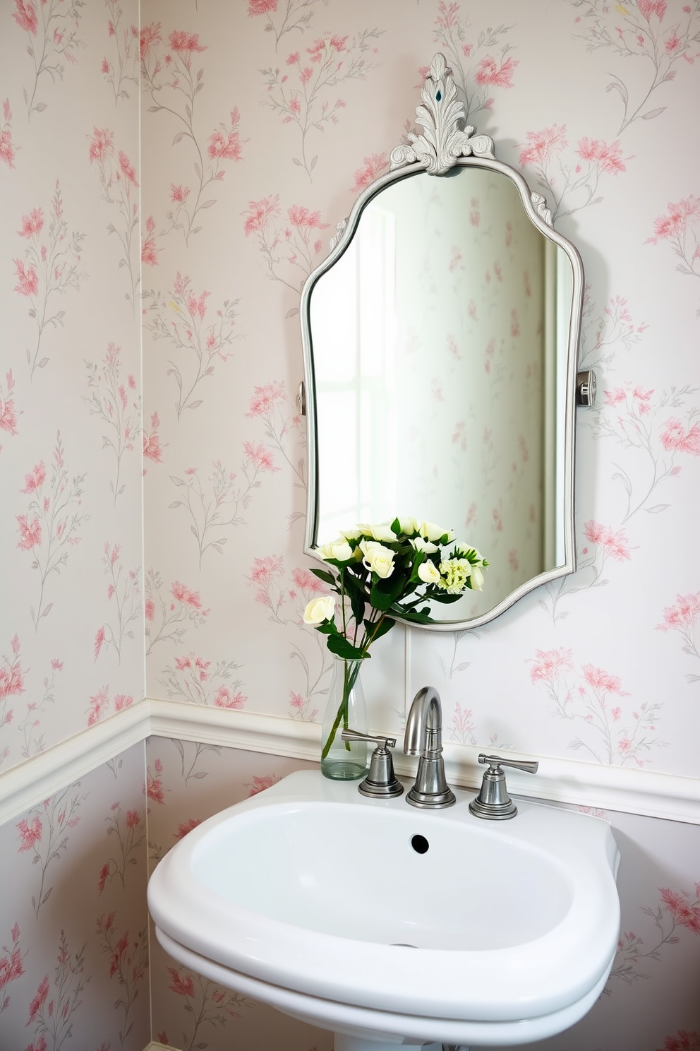 A serene powder room featuring muted pastel wallpaper with delicate floral patterns. The walls are adorned with soft pink and light blue hues, creating a calming atmosphere complemented by a sleek white pedestal sink and a vintage-style mirror.