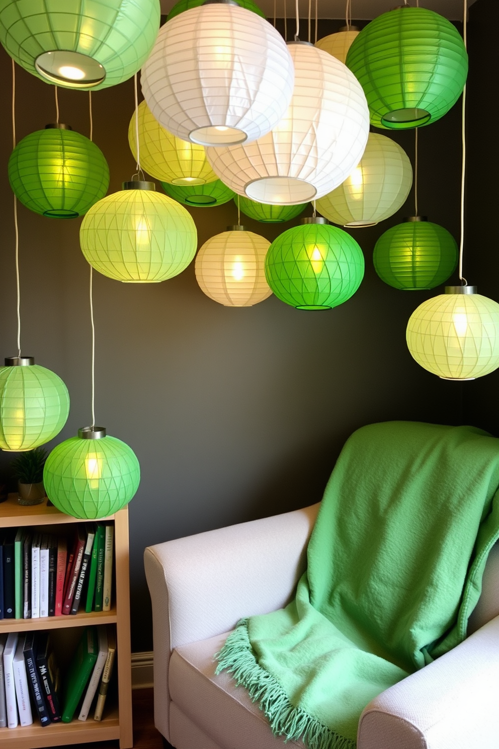 A cozy reading nook adorned with hanging paper lanterns in various shades of green. The space features a plush armchair, a small bookshelf filled with books, and a soft green throw blanket draped over the armrest.