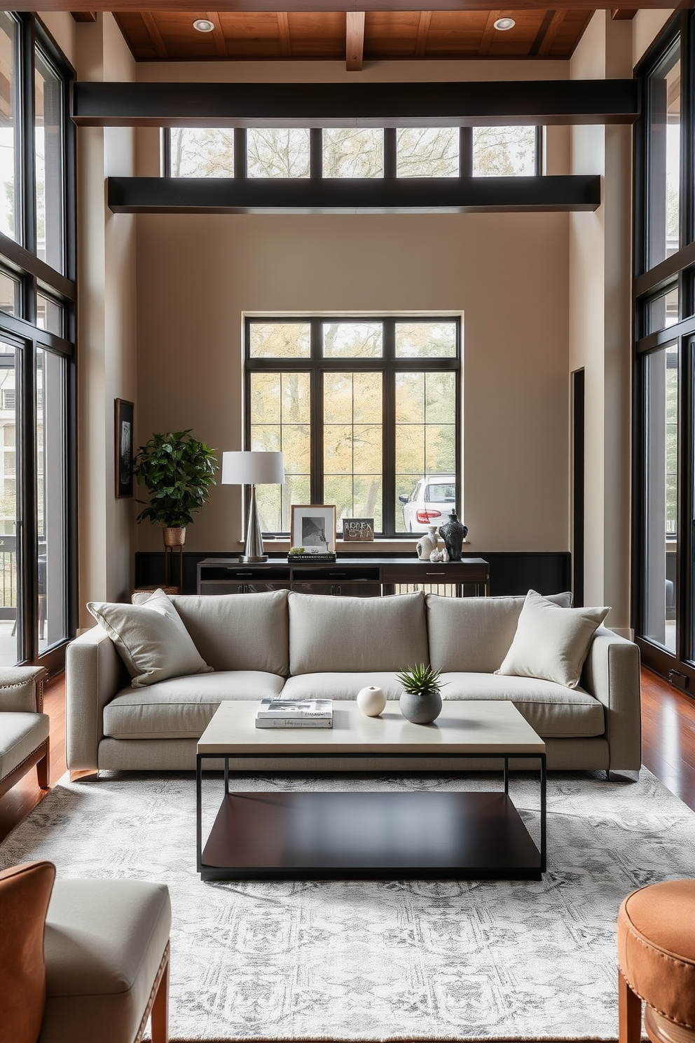 A narrow console table is positioned behind a plush sofa, creating a functional yet stylish focal point in the living room. The table is adorned with decorative items such as a sleek lamp, a stack of art books, and a small potted plant for a touch of greenery. The living room features a rectangle layout, with the sofa facing a modern coffee table and a cozy area rug anchoring the space. Large windows allow natural light to flood the room, highlighting the warm color palette and inviting atmosphere.