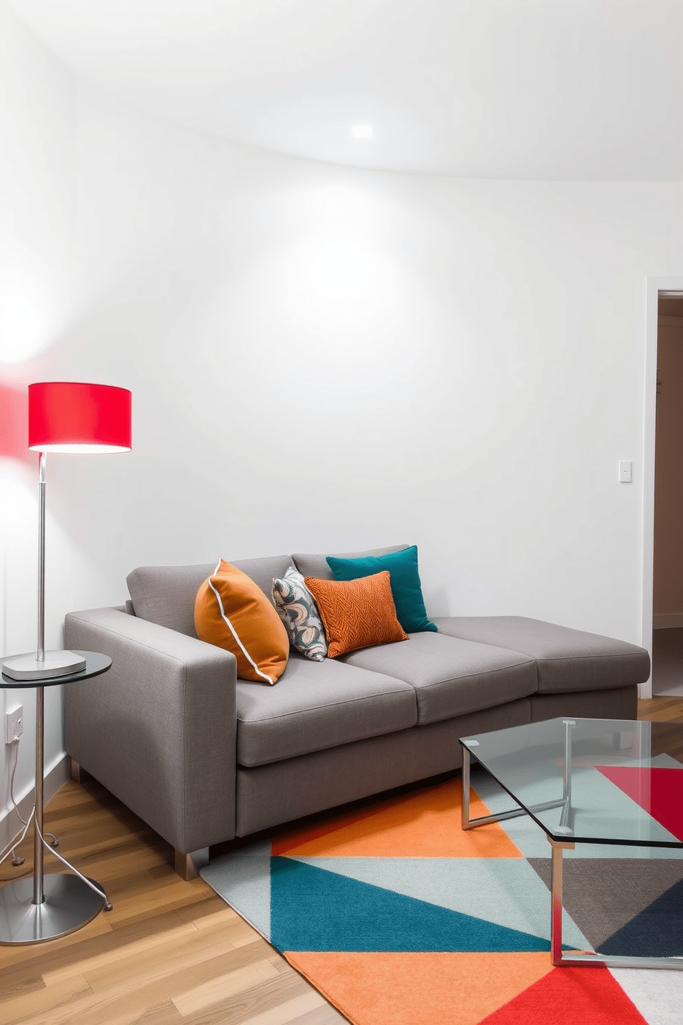 A modern apartment living room featuring a bright red accent lamp that adds a pop of color. The lamp stands on a sleek side table next to a plush gray sofa adorned with colorful cushions. The walls are painted in a soft white, creating a bright and airy atmosphere. A geometric area rug in contrasting colors lies beneath a glass coffee table, enhancing the contemporary design.