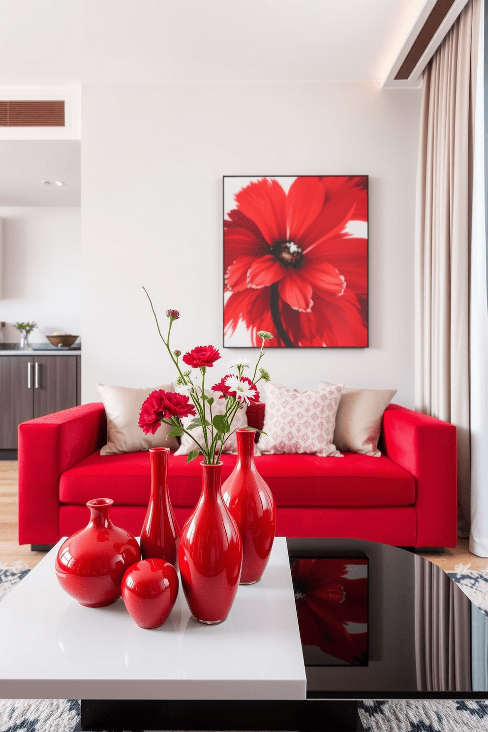 A vibrant living space featuring red decorative vases styled elegantly on a sleek coffee table. The vases vary in height and shape, filled with fresh flowers that complement the room's color palette. A contemporary apartment design that showcases a bold use of red accents throughout the space. The living area includes a plush red sofa paired with neutral-toned cushions and a striking piece of artwork that ties the design together.