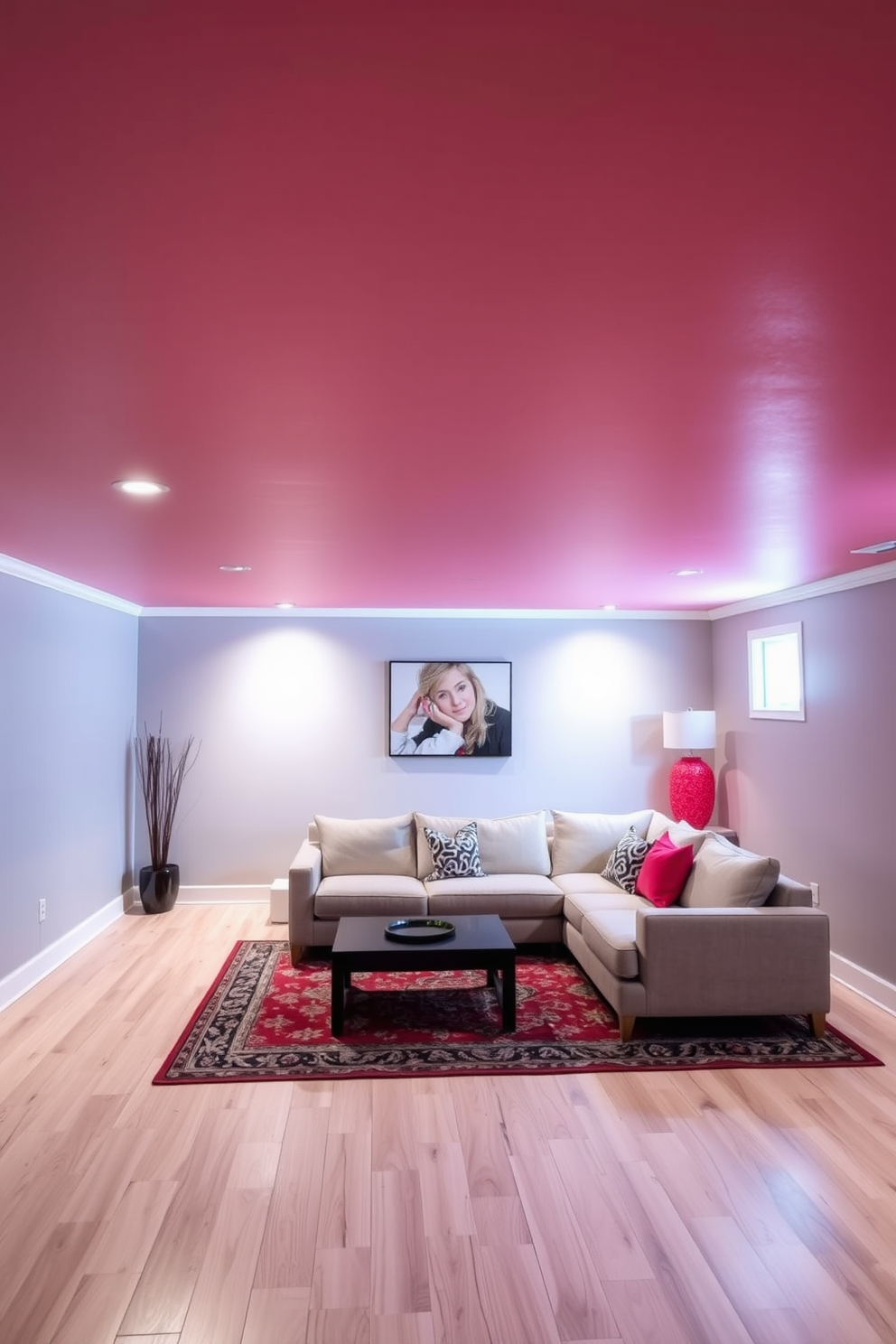 A light red ceiling creates an airy and uplifting atmosphere in the basement. The walls are painted in a soft gray to complement the ceiling, and the flooring features light-colored wooden planks for warmth. Incorporate comfortable seating with a modern sectional sofa in a neutral tone. Add vibrant accent pillows and a stylish area rug to define the space and enhance coziness.