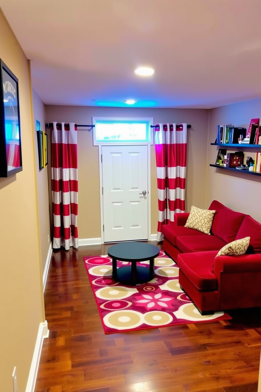 A playful basement space featuring red and white striped curtains that add a lively touch to the room. The walls are painted a warm beige, and the flooring consists of dark hardwood, creating a cozy atmosphere. In one corner, there is a comfortable sectional sofa upholstered in a deep red fabric, paired with a round coffee table. A vibrant area rug with geometric patterns anchors the seating area, while wall-mounted shelves display colorful decor and books.