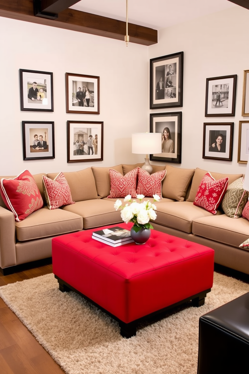 A vibrant red ottoman serves as the statement piece in a modern family room. The space features a cozy sectional sofa in neutral tones, complemented by colorful throw pillows that enhance the overall warmth and inviting atmosphere. The walls are adorned with framed artwork that reflects family memories and personal style. A plush area rug anchors the seating arrangement, while stylish lighting fixtures create a welcoming ambiance for gatherings.