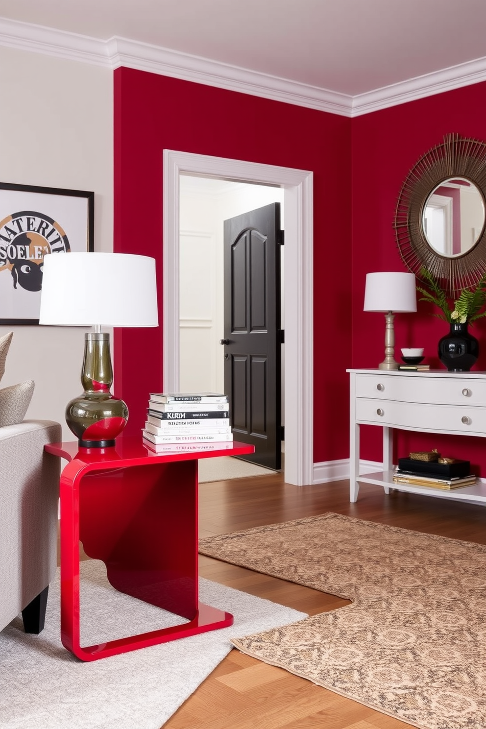 A contemporary red side table stands in a cozy living room, featuring a sleek design with clean lines and a glossy finish. It is complemented by a stylish lamp and a stack of art books, adding a pop of color and functionality to the space. The foyer is designed with a modern aesthetic, showcasing a red accent wall that creates a bold entrance. A minimalist console table with a decorative mirror above it enhances the space, while a chic area rug adds warmth and texture to the floor.