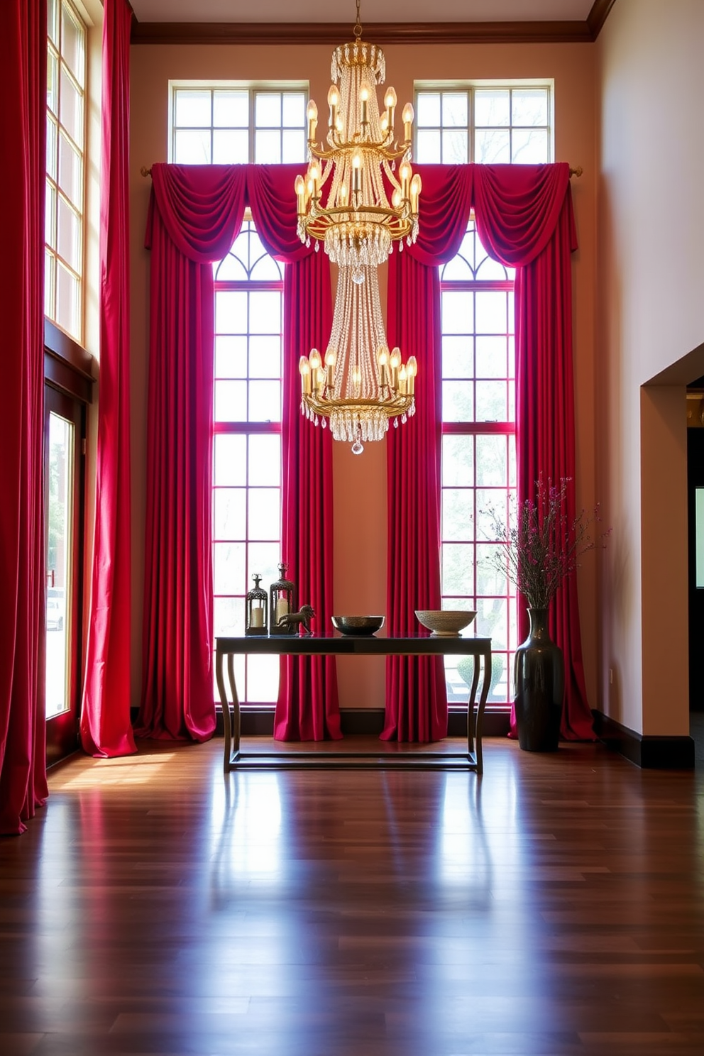 Elegant red drapes frame the tall windows, cascading down to the polished wooden floor. The rich fabric adds a touch of luxury to the space, enhancing the natural light that filters through. The foyer features a stunning chandelier that hangs gracefully from the ceiling, casting a warm glow throughout the area. A sleek console table, adorned with decorative accents, creates an inviting atmosphere for guests entering the home.