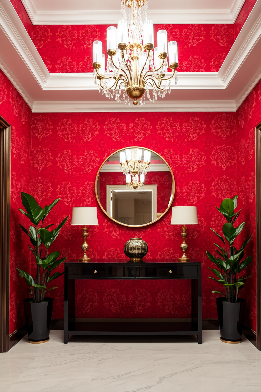 A striking foyer adorned with bold red wallpaper featuring intricate gold accents. The space is illuminated by a grand chandelier that hangs from a high ceiling, creating a dramatic entrance. A sleek console table made of dark wood is positioned against the wall, topped with a large round mirror that reflects the vibrant colors. Flanking the console are elegant potted plants that add a touch of greenery to the luxurious design.