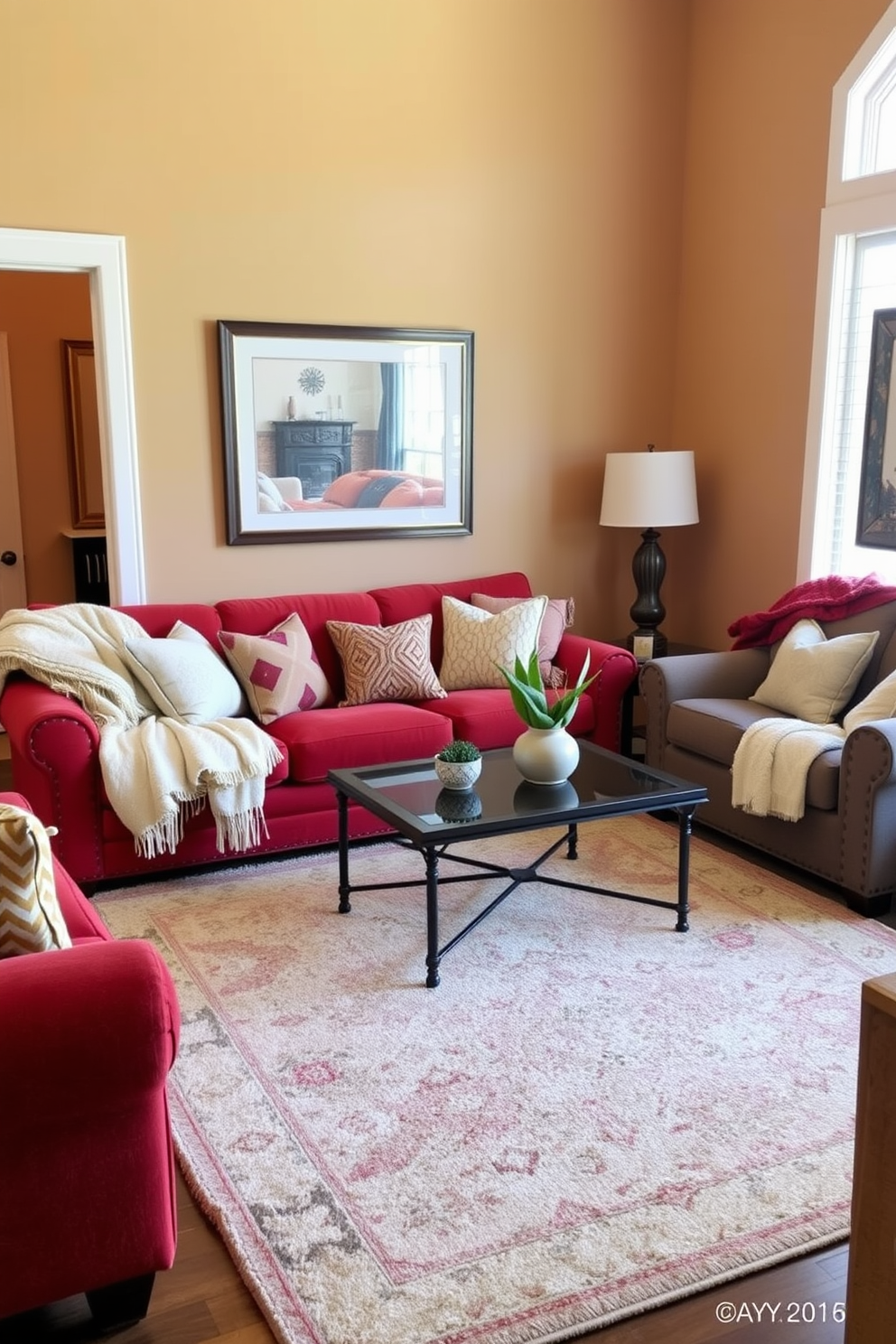 A cozy living room setting with a plush red sofa adorned with soft throw blankets. The walls are painted in a warm neutral tone, and a large area rug ties the space together, creating an inviting atmosphere. Accent pillows in various textures complement the red throw blankets, adding depth to the design. A stylish coffee table sits in the center, surrounded by comfortable seating options for a relaxed gathering space.